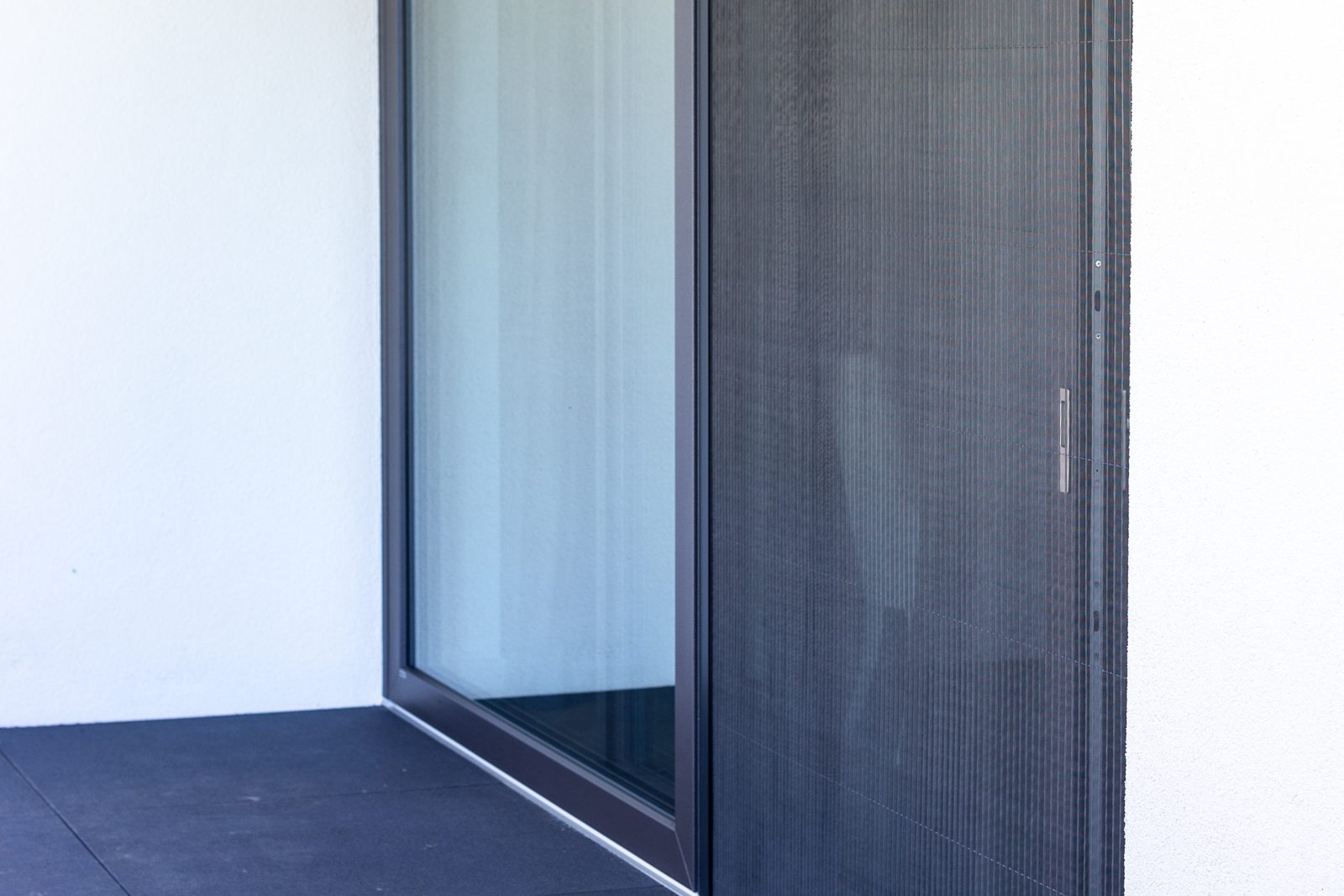 Insect screen fitted to a sliding patio door